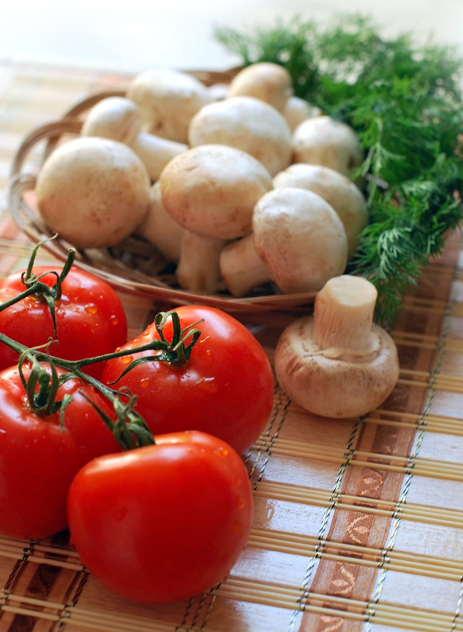 four red tomatoes and mushroooms