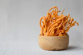 Cordyceps Mushrooms in a wooden bowl